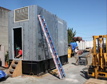 Super quiet emergency-standby diesel generator module during construction. Complete module will support a San Francisco area telecommunications facility.